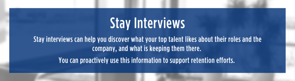 White text over blue semi-transparent background reads "Stay interviews can help you discover what your top talent likes about their roles and the company, and what is keeping them there.
You can proactively use this information to support retention efforts."